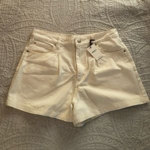 White pleat front jean shorts